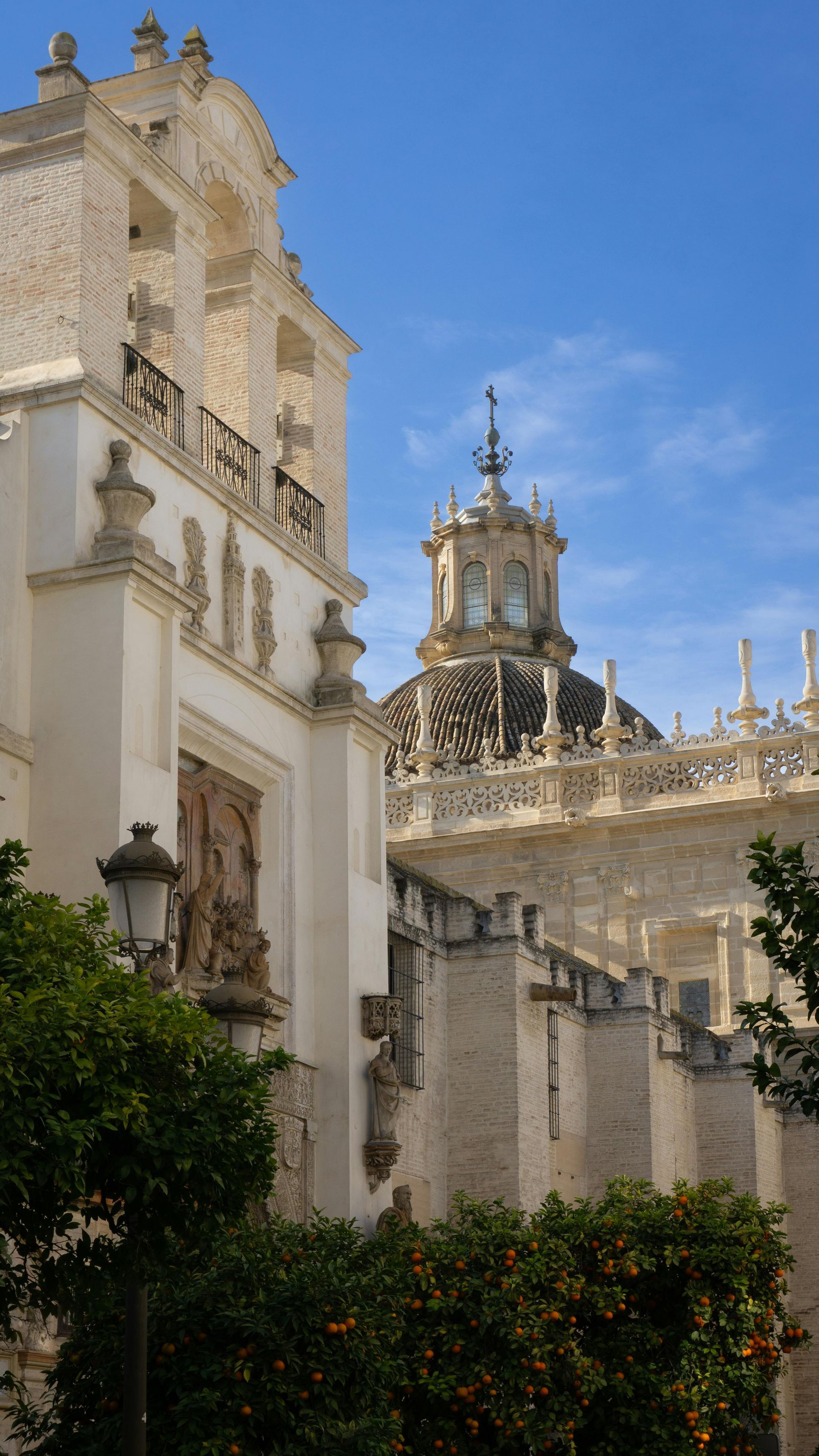 A large white building with a clock tower on top of it.