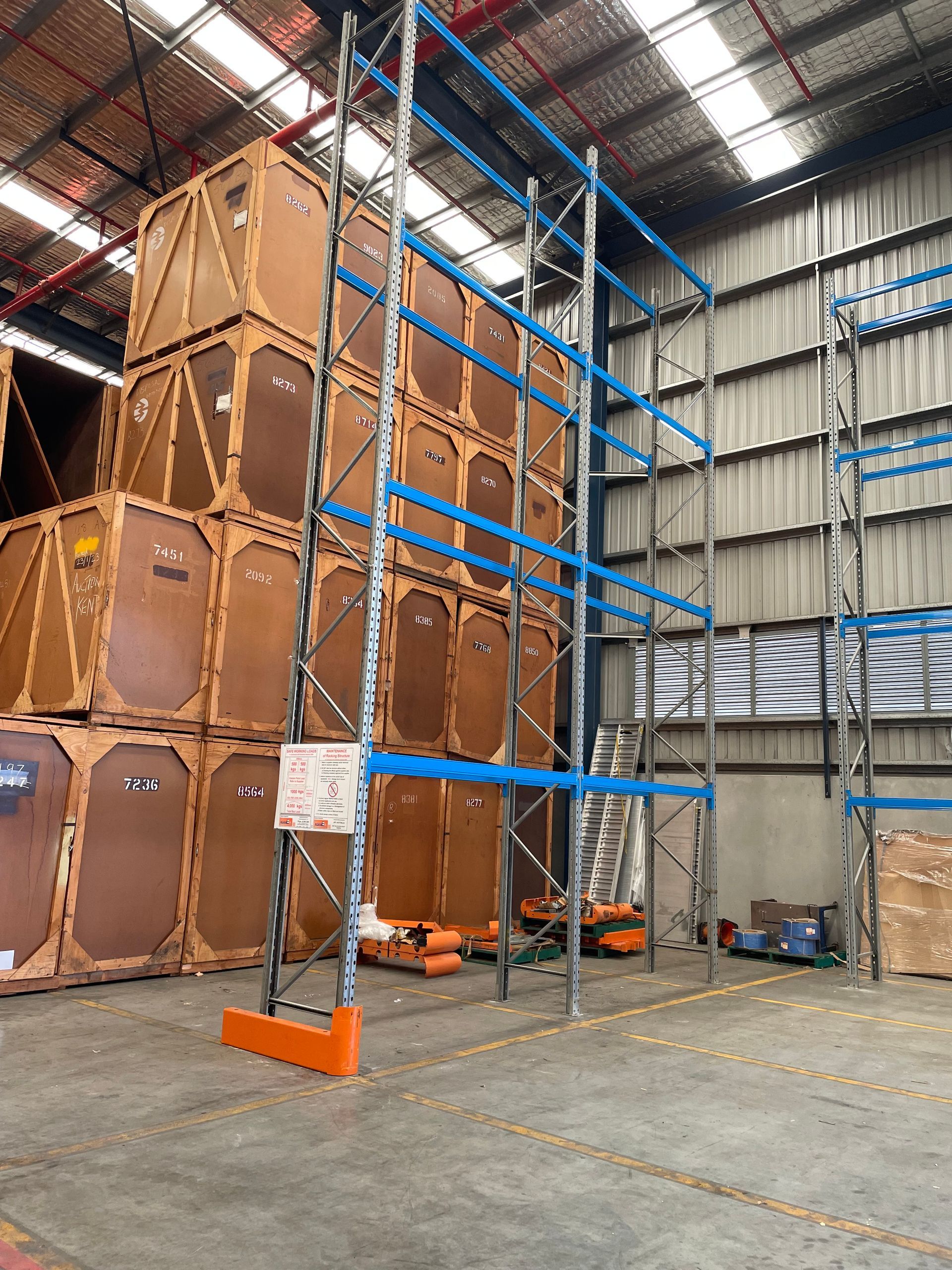 A Ceiling With Wooden Beams And Plants Hanging From It — Shop Fittings Office Furniture Materials Handling In Gosford, NSW