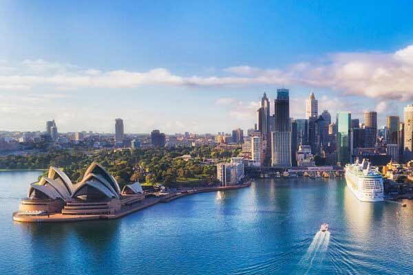 An Aerial View Of Sydney With The Opera House And A Cruise Ship In The Water — Shop Fittings Office Furniture Materials Handling In Sydney, NSW