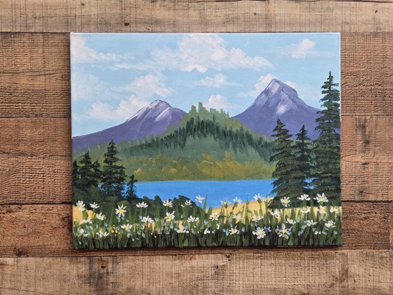 Mountain landscape painting with blue lake, purple peaks, evergreen trees, and white wildflowers