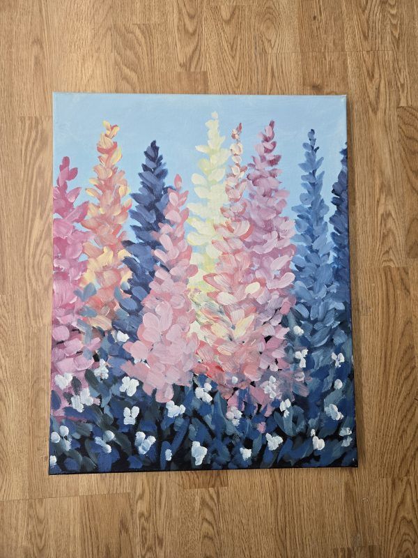 Pastel floral painting with pink, blue, and lavender blossoms on a light blue background