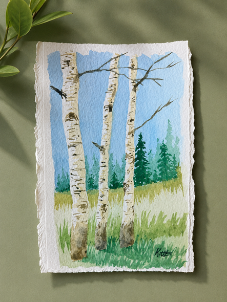 Person painting colorful landscapes on easels in an art studio class