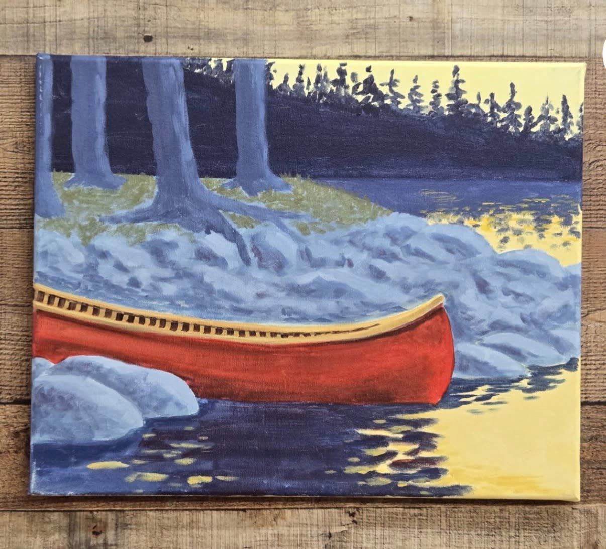 Red canoe beside a rocky lakeshore at dusk, with blue trees and water reflections.