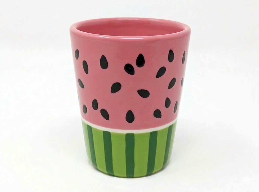 Pink and green striped cup with watermelon seed pattern