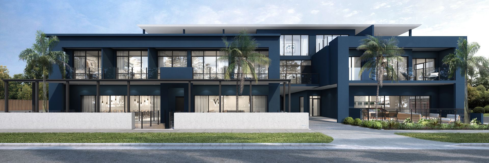 Modern two-story apartment building with dark exterior, balconies, and landscaped frontage