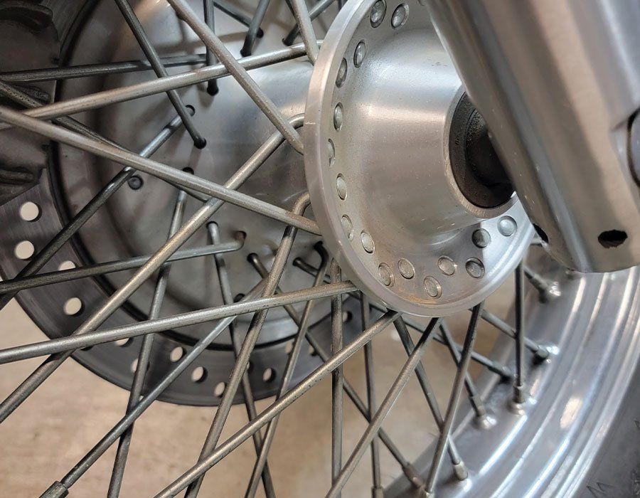 A close up of the front wheel of a motorcycle