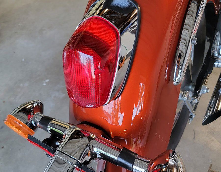 A close up of a motorcycle 's tail light
