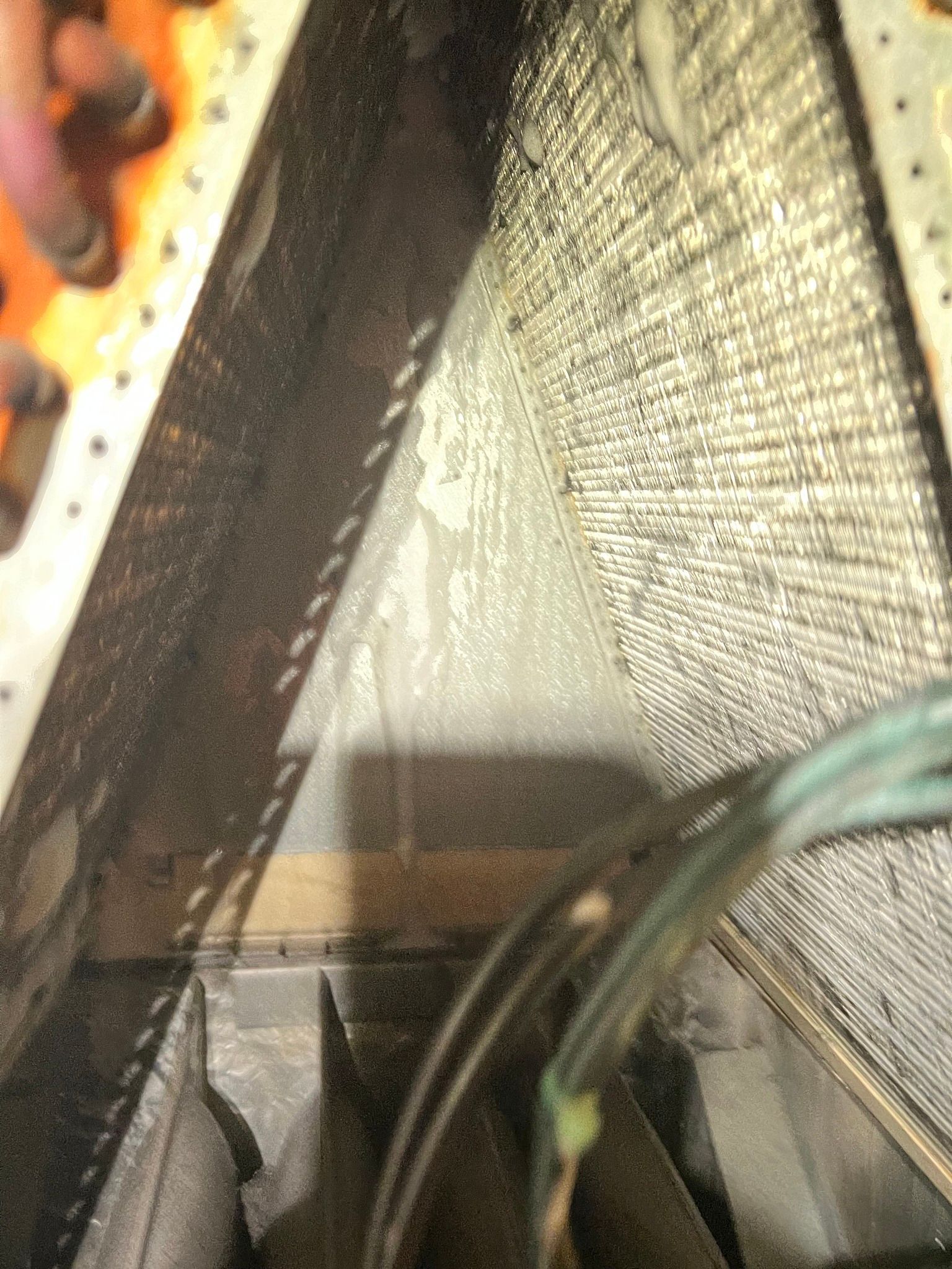Comfy Castle Heating and Air - A close up of a piece of metal with a lot of wires coming out of it.