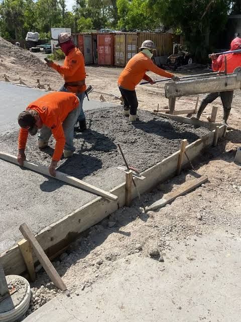 Stratford Concrete crew leveling wet concrete during general construction work
