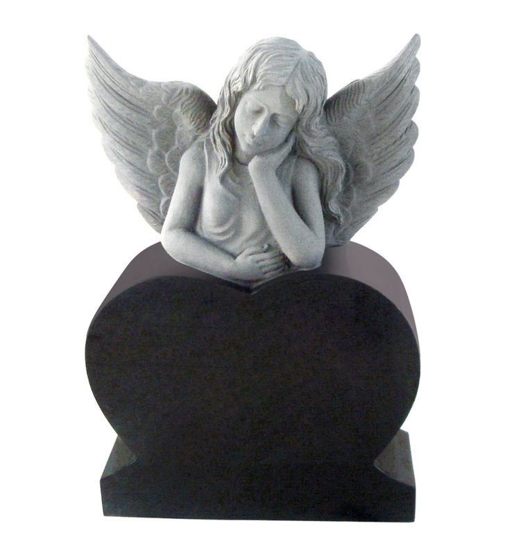 Gray angel figurine resting on a black oval pedestal, hands on chin, with wings spread