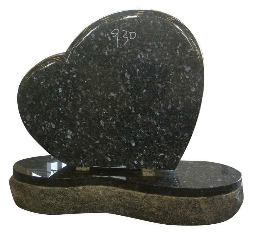 Black heart-shaped gravestone on a dark oval base