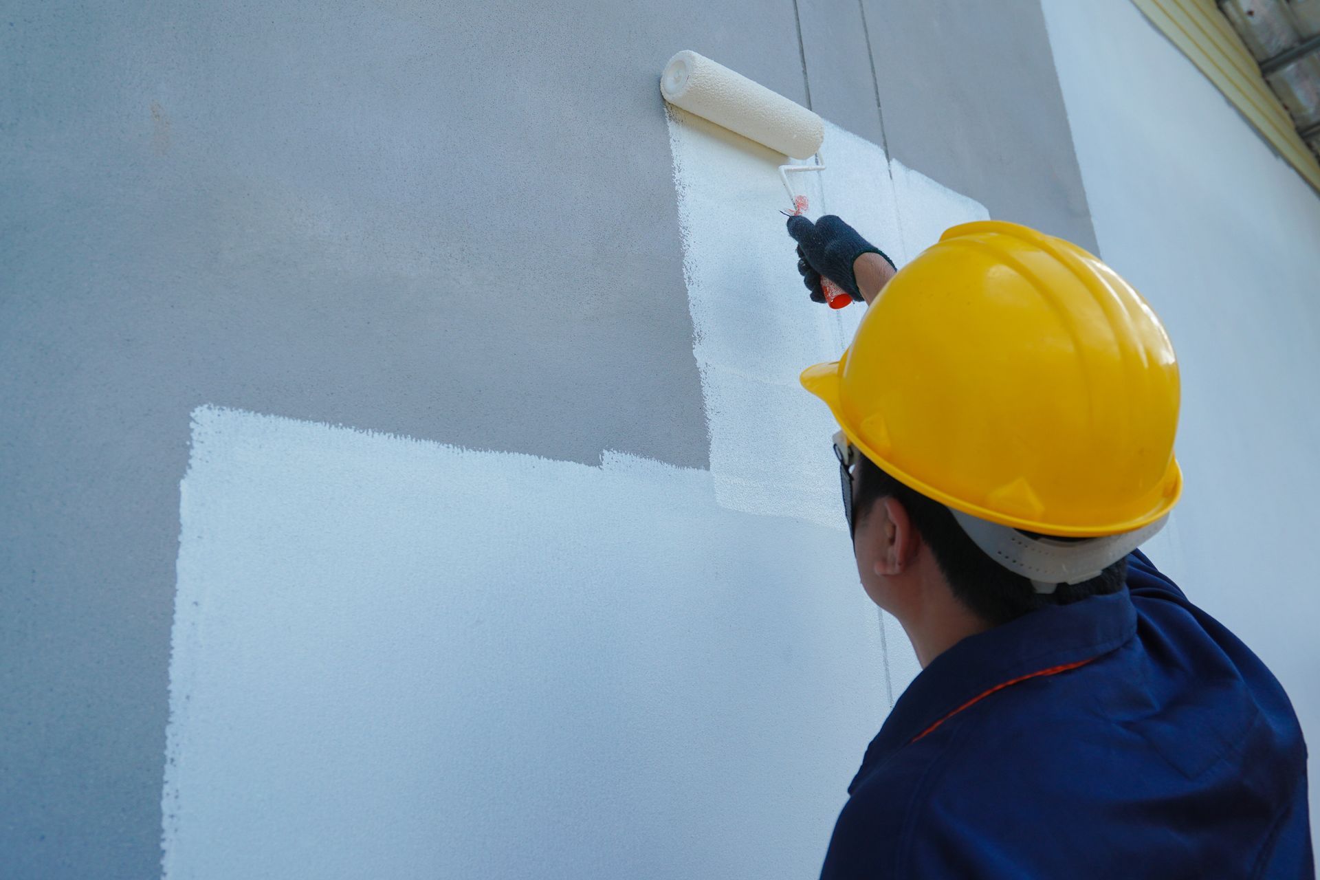 Commercial Business getting a fresh coat of grey paint.