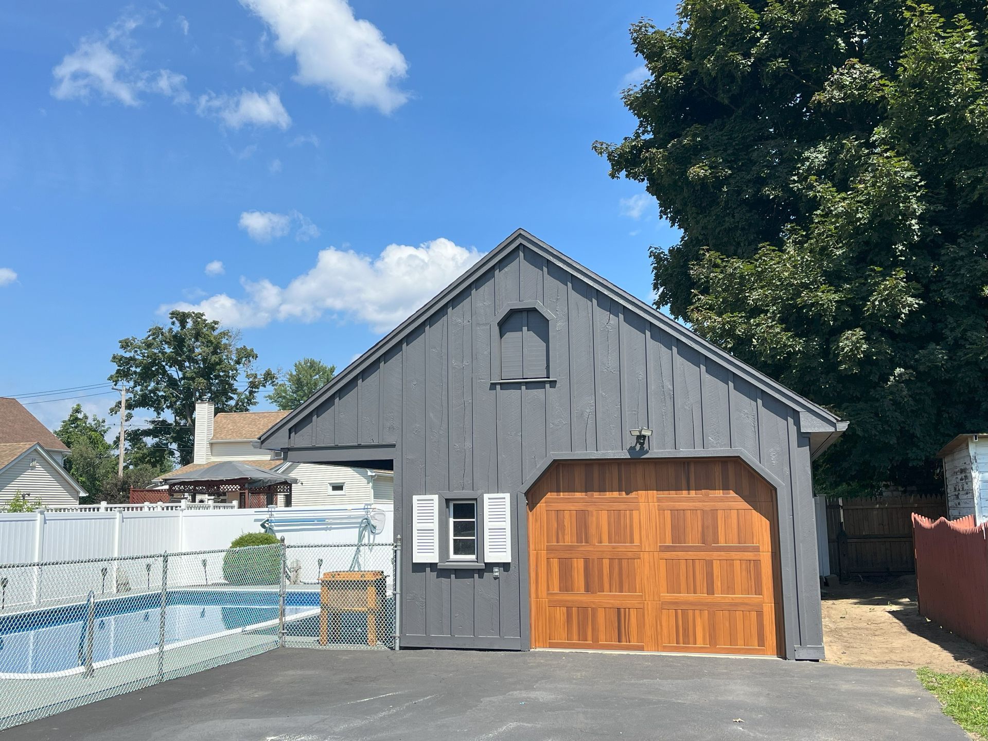 Garage style guest home exterior painting in Monsoon, MA