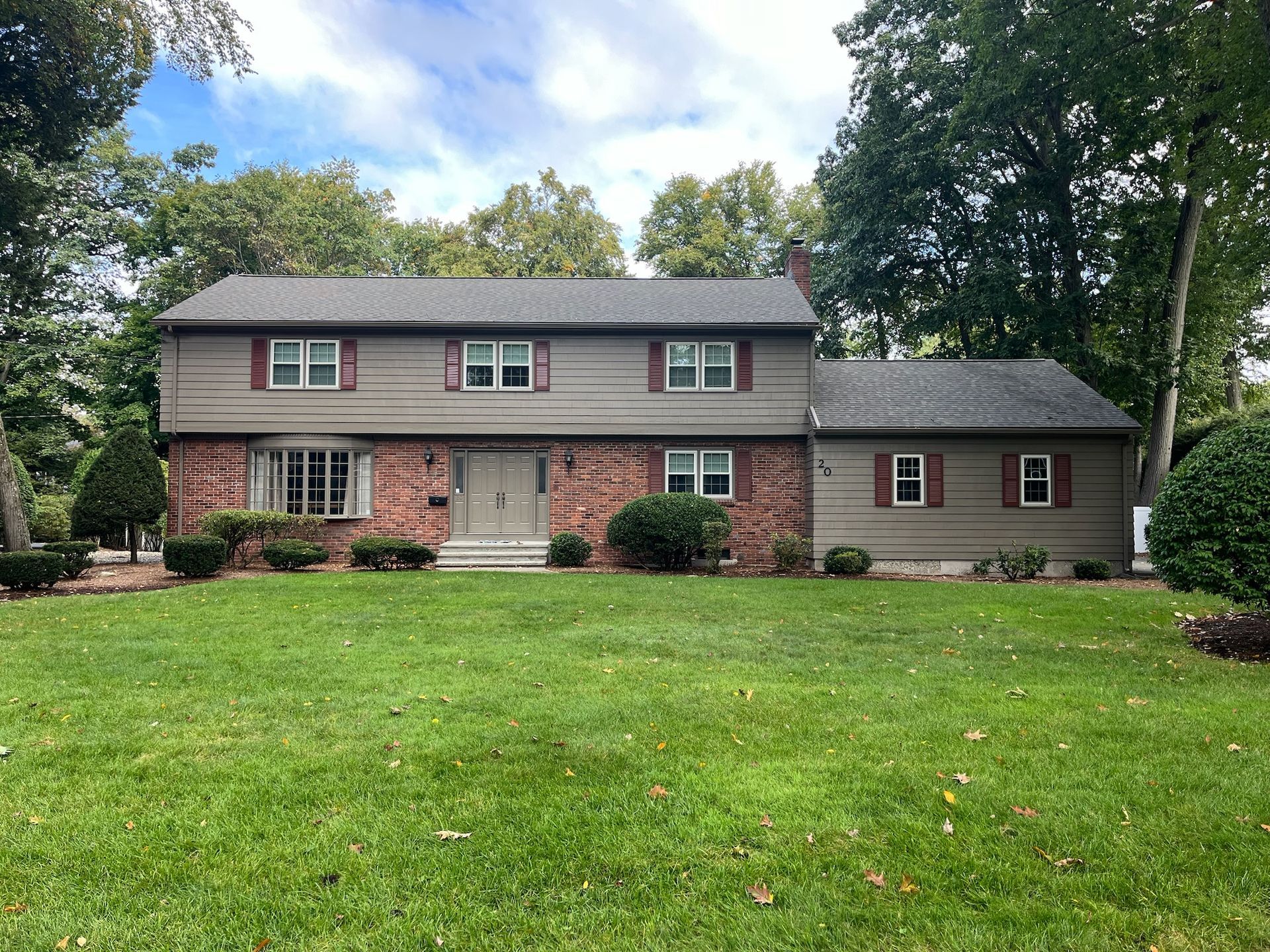 Front door being painted on a home by Pioneer Painters in Longmeadow, MA
