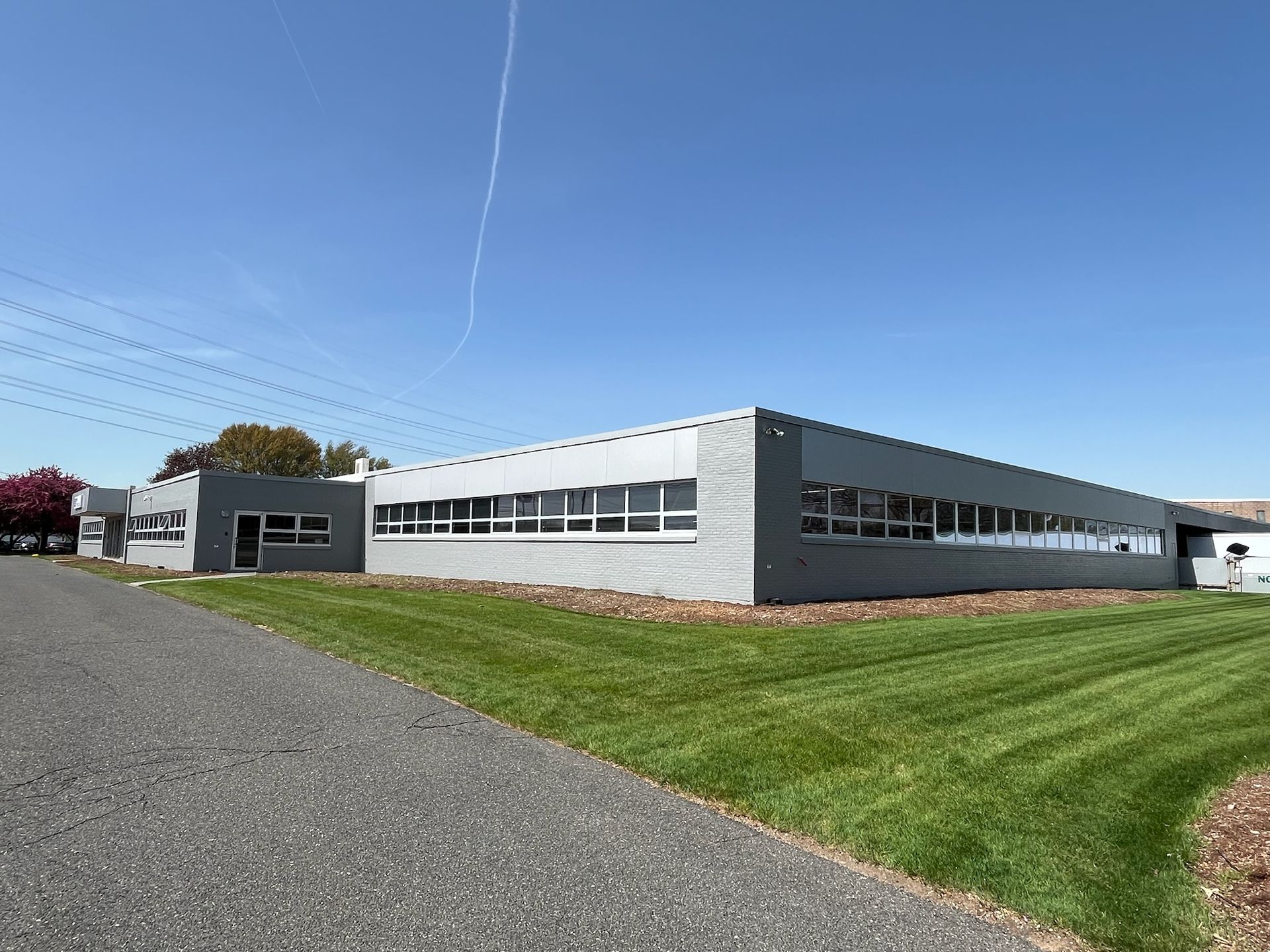 Commercial facility exterior siding painting project by Pioneer Painters in Enfield, CT