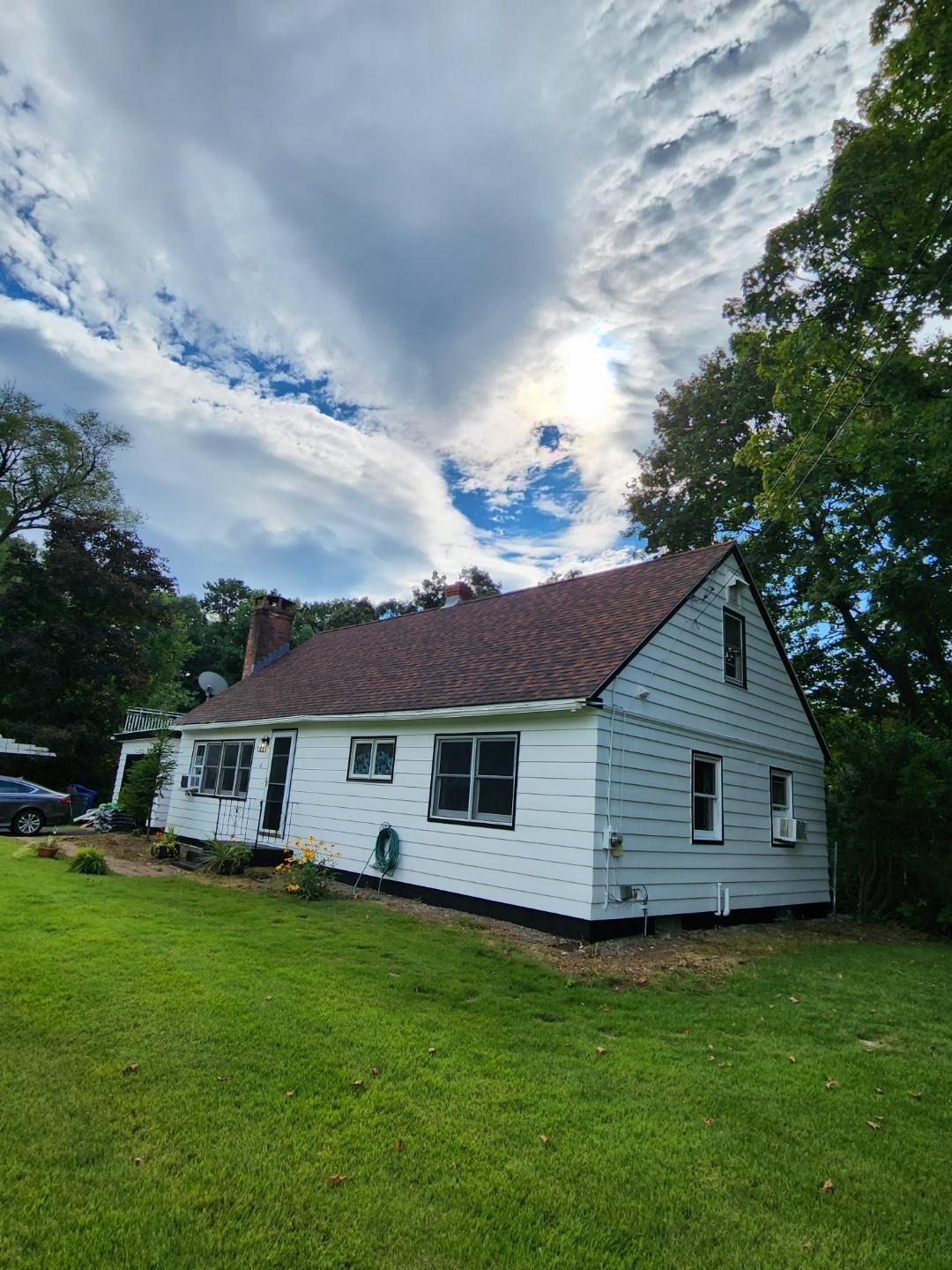 Exterior siding painting project by Pioneer Painters in Somers, CT