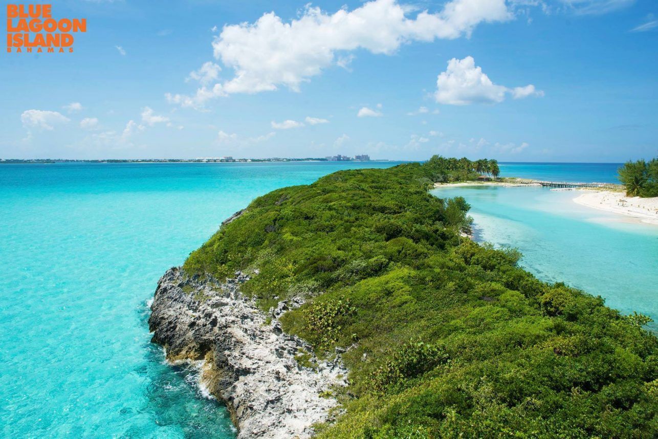 Tips for visiting Blue Lagoon Island Bahamas: beach lounger by the turquoise lagoon