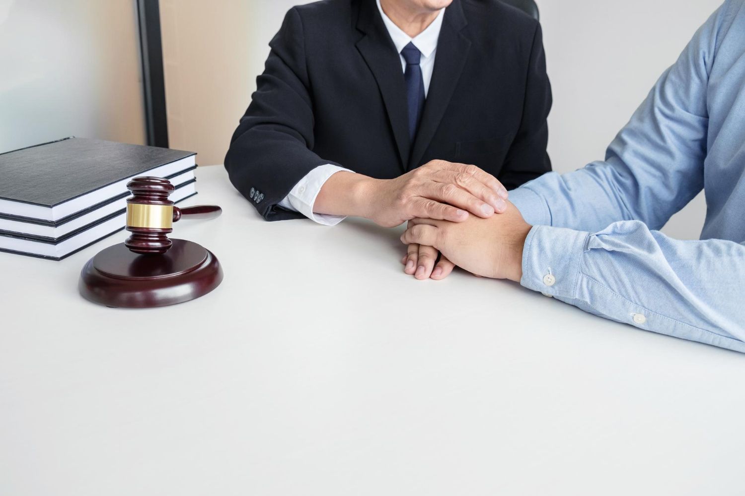 Two business professionals in suits reviewing documents, discussing strategy.