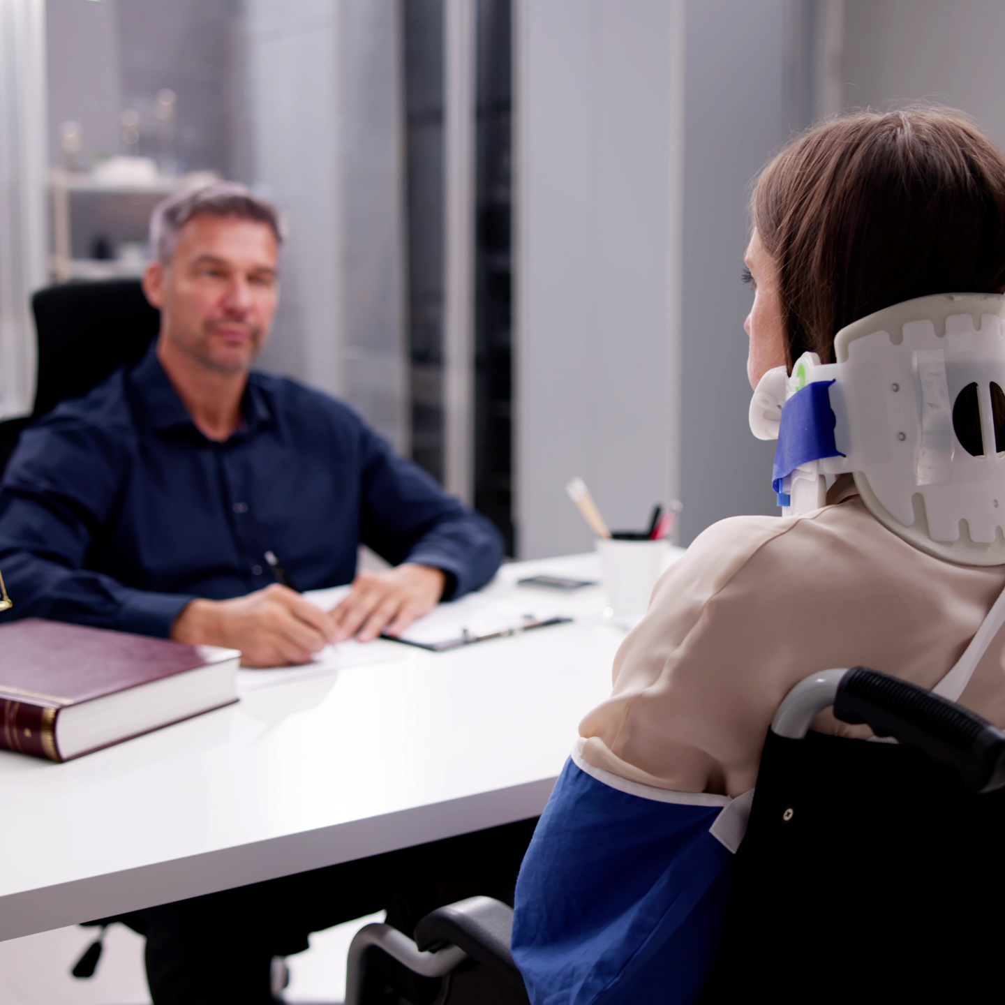 Two business professionals in suits reviewing documents, discussing strategy.