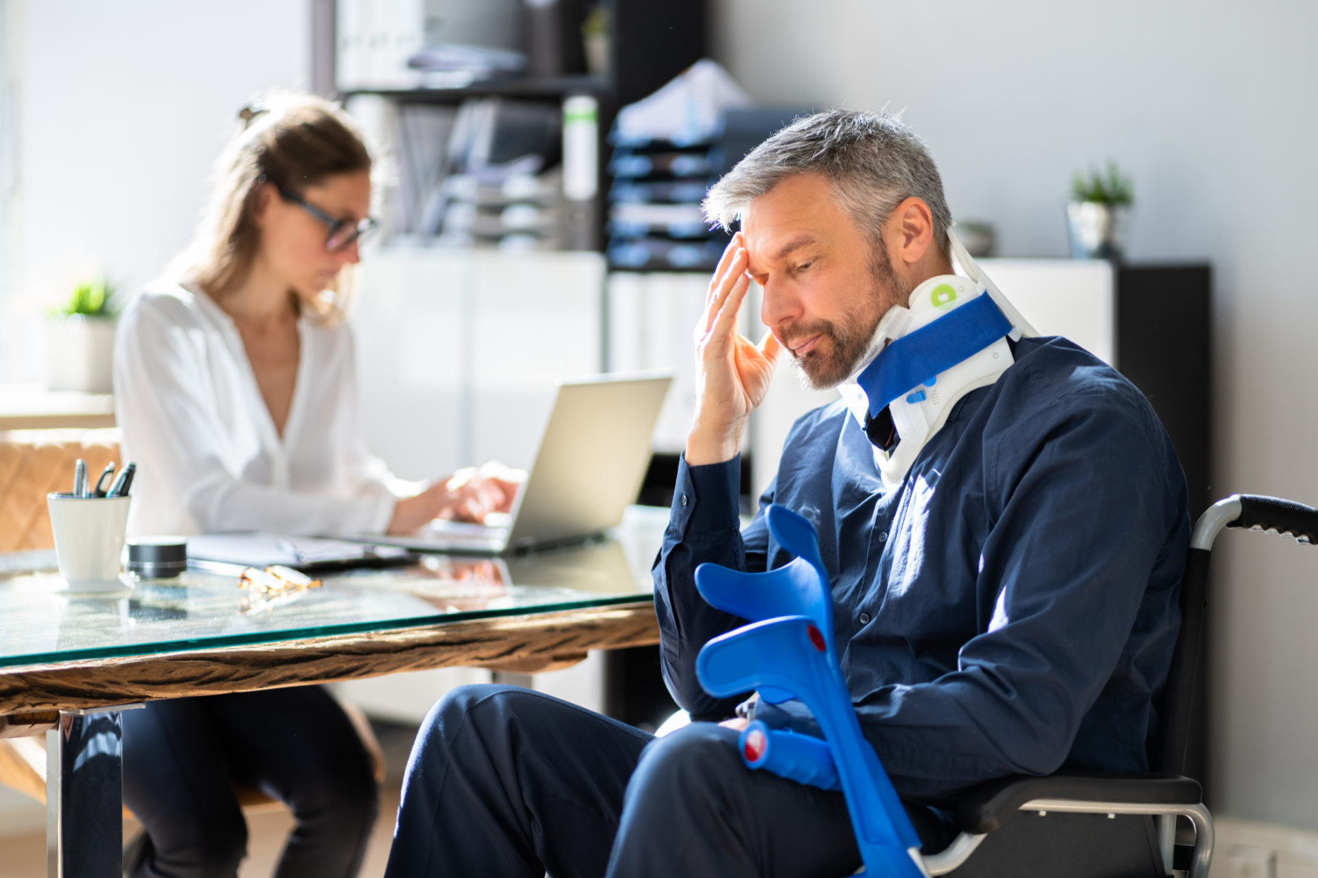 Two business professionals in suits reviewing documents, discussing strategy.