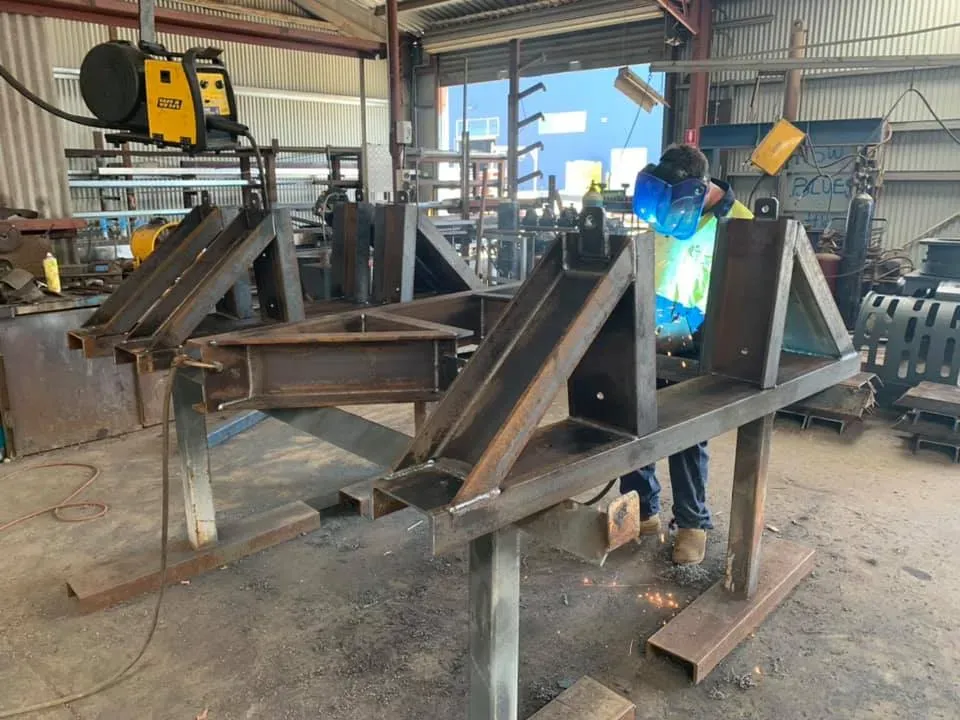 Man Fabricating Steel in the Garage — Arc Attack Fabrication in Woolgoolga, NSW