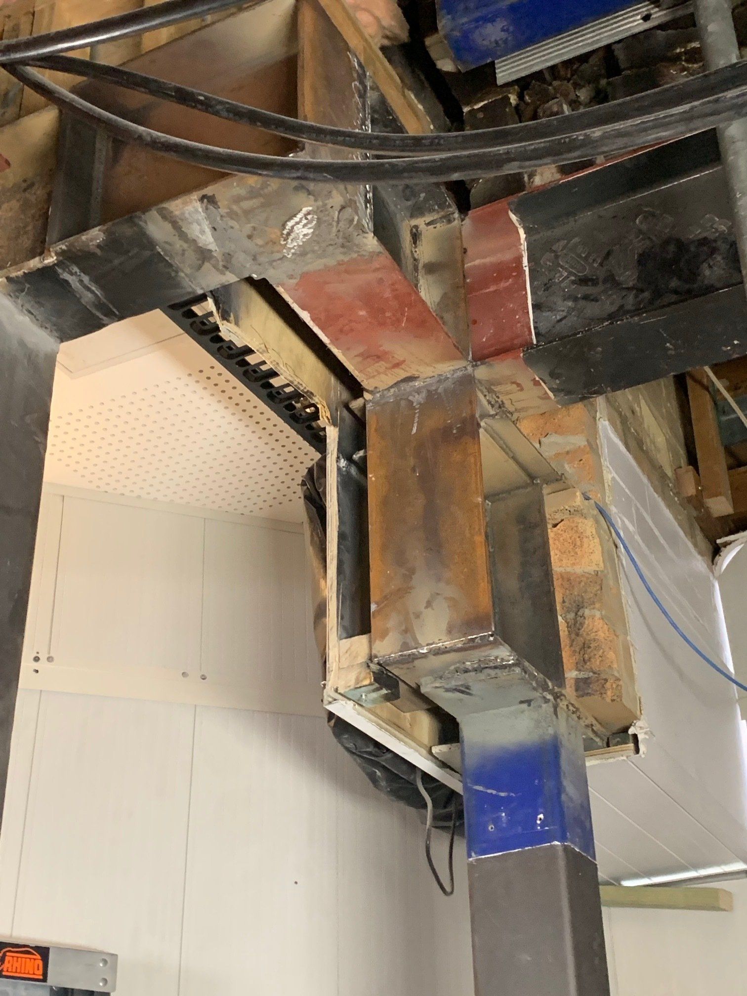 A ceiling with a lot of wires hanging from it