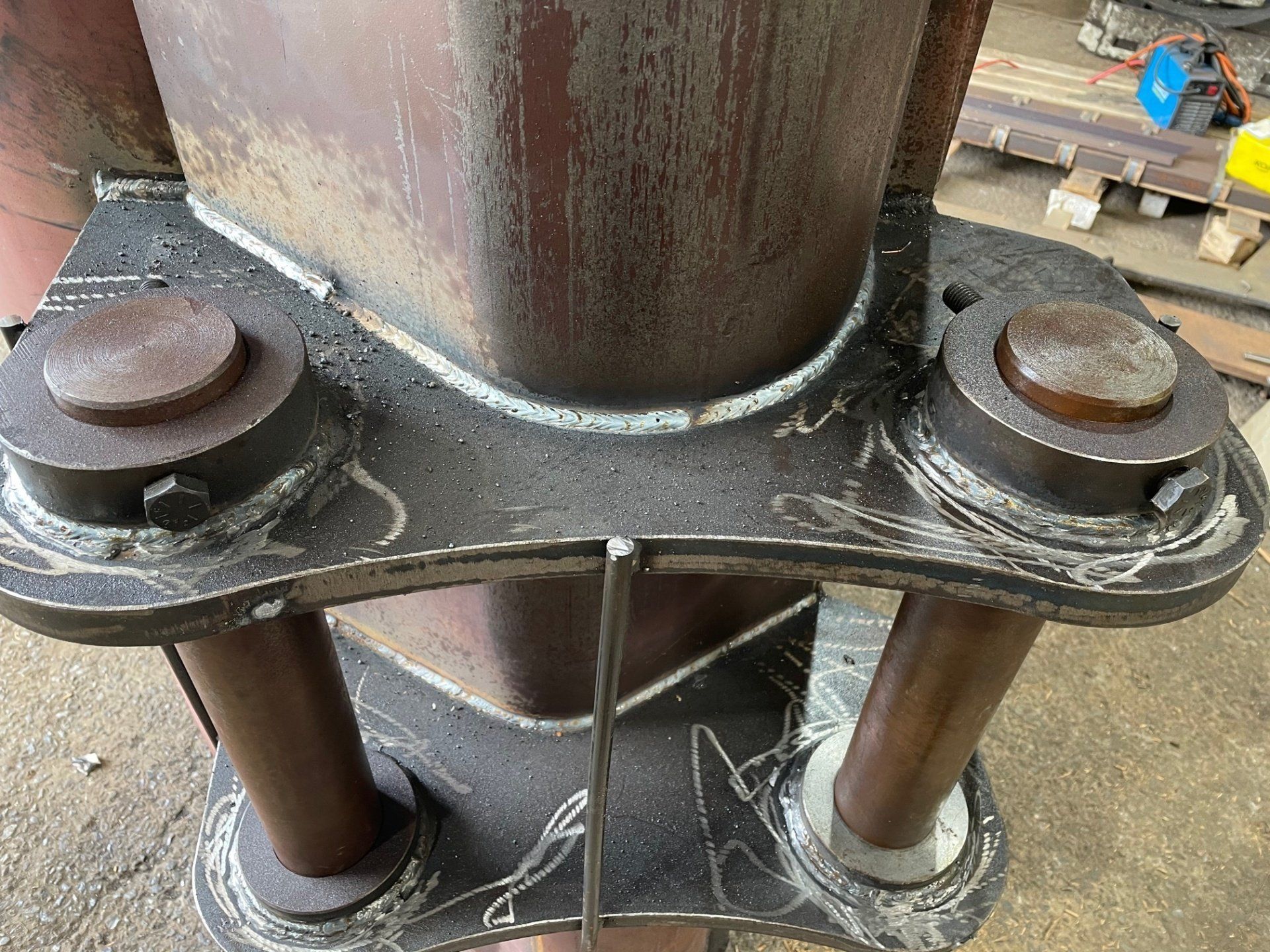 A close up of a metal structure with a few pieces of metal attached to it.