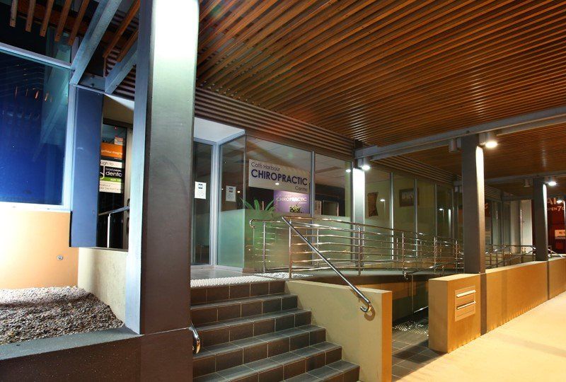 A building with stairs and a sign that says chiropractic