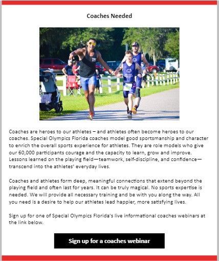 A couple of men are running down a path holding hands.