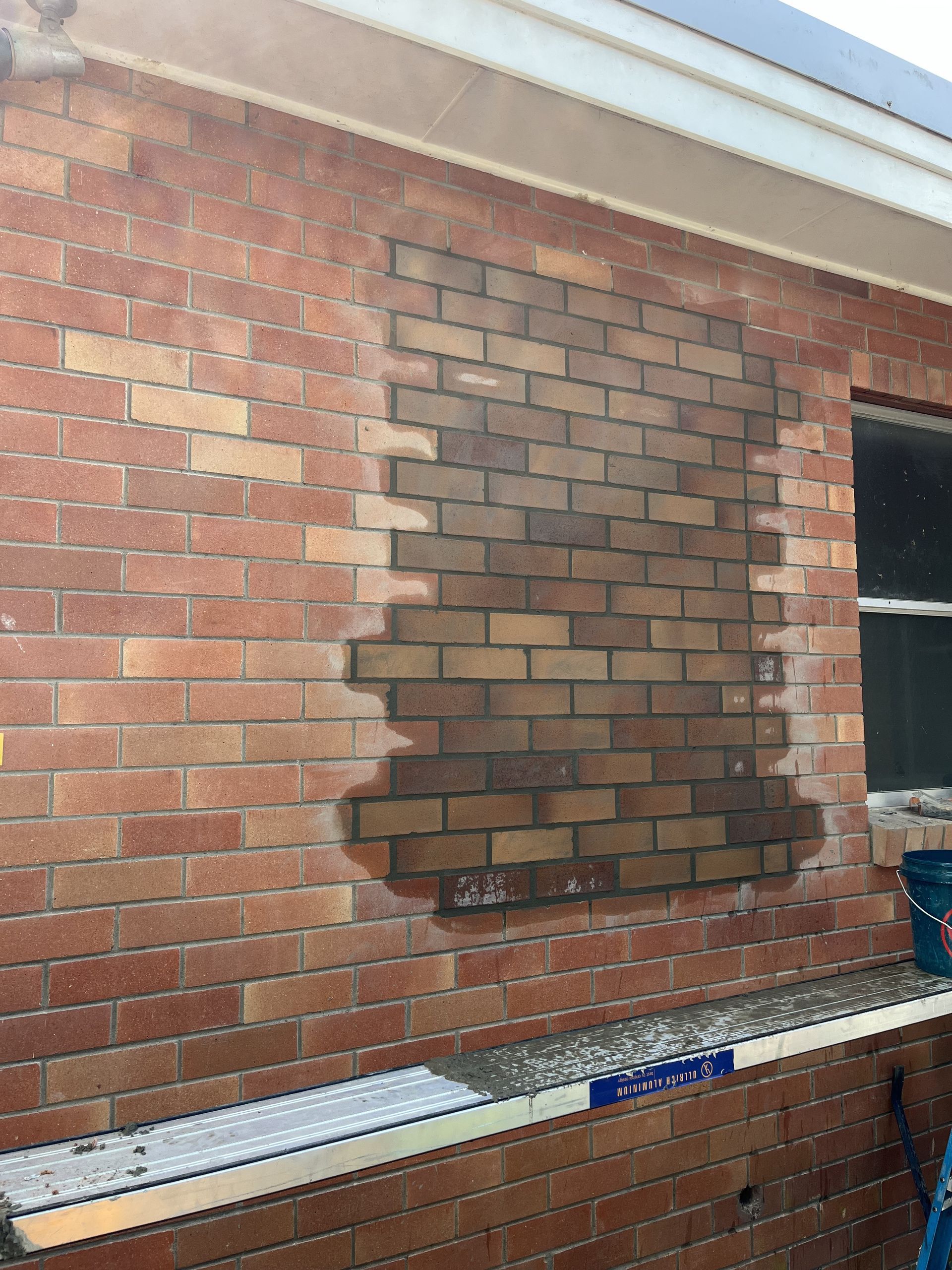 Brick Wall With a Window and a Ladder — TM Built Construction In Cessnock, NSW