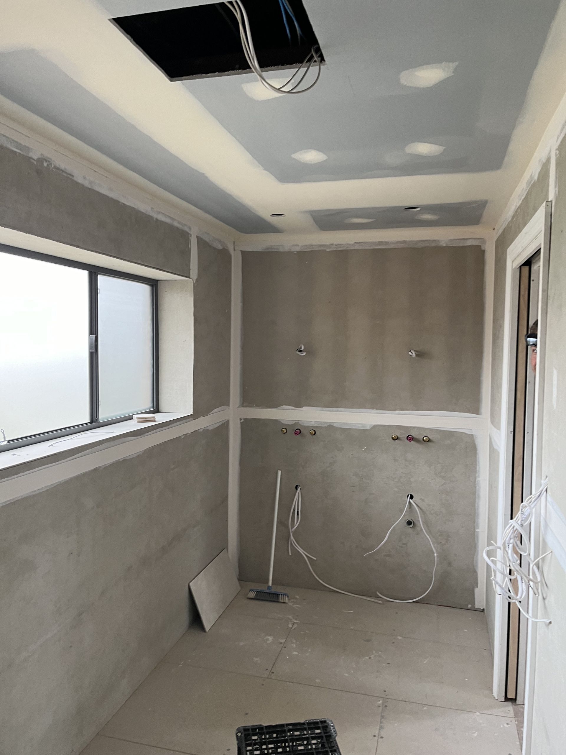 A Bathroom With a Bathtub and Mirror — TM Built Construction In Singleton, NSW