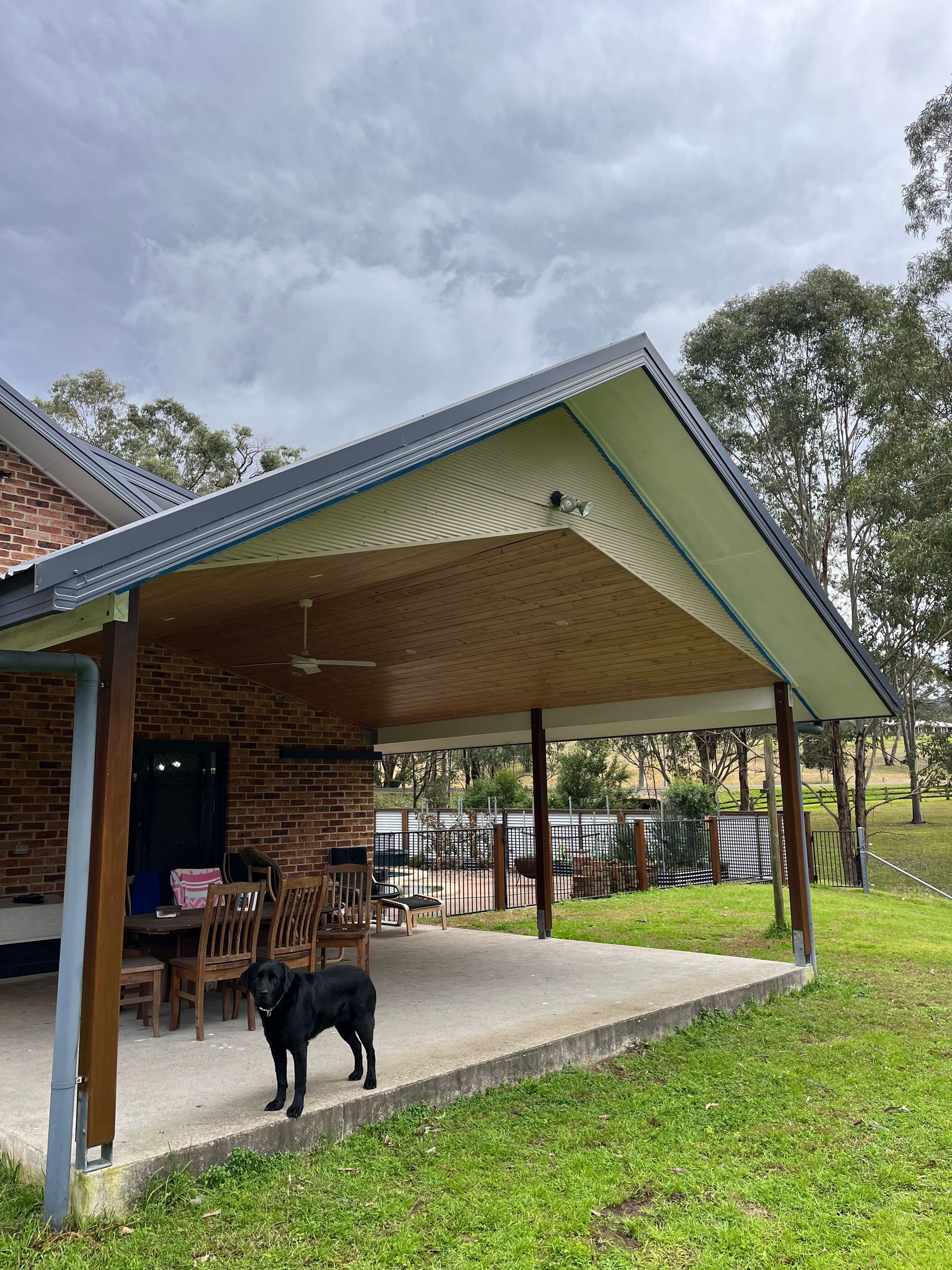 A White Van is Parked in Front of a House — TM Built Construction In Lochinvar, NSW