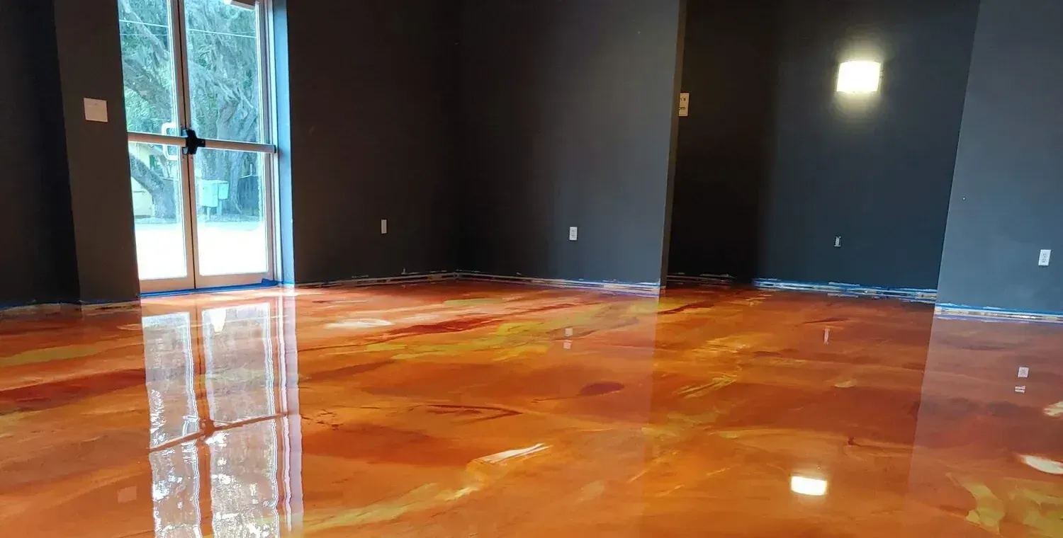 Empty dark room with glossy orange-brown floor reflecting windows and lights