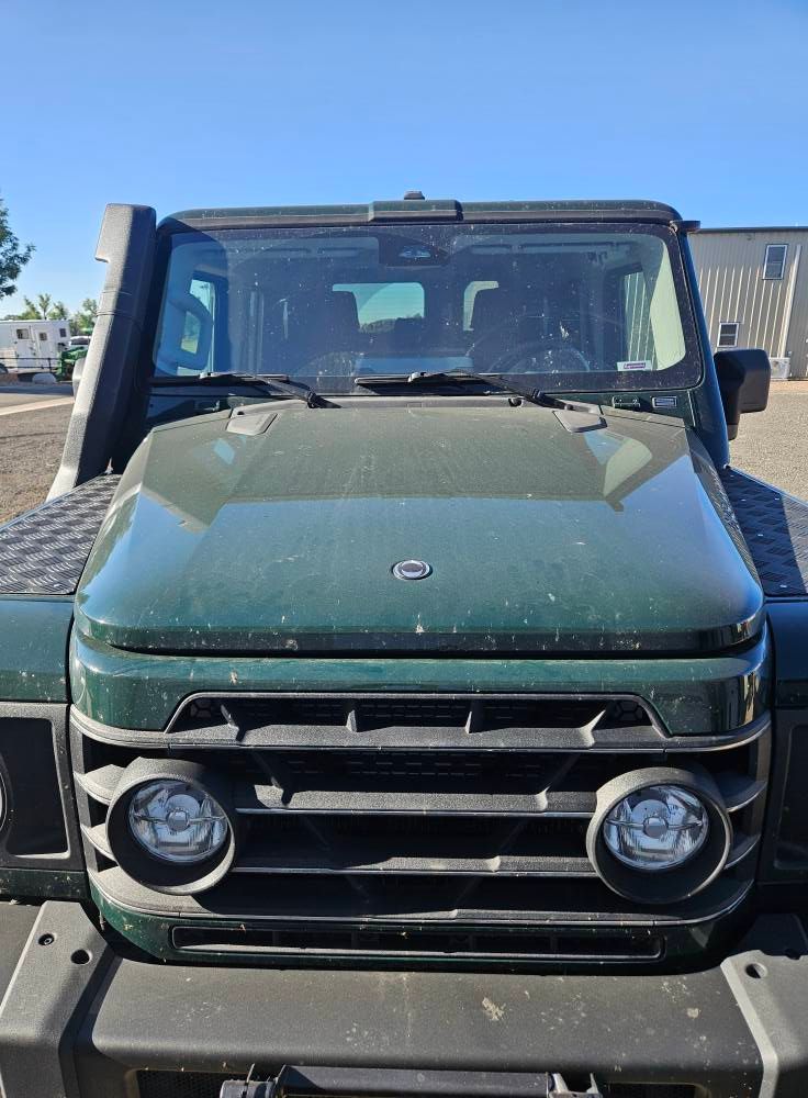 green vehicle before detailing