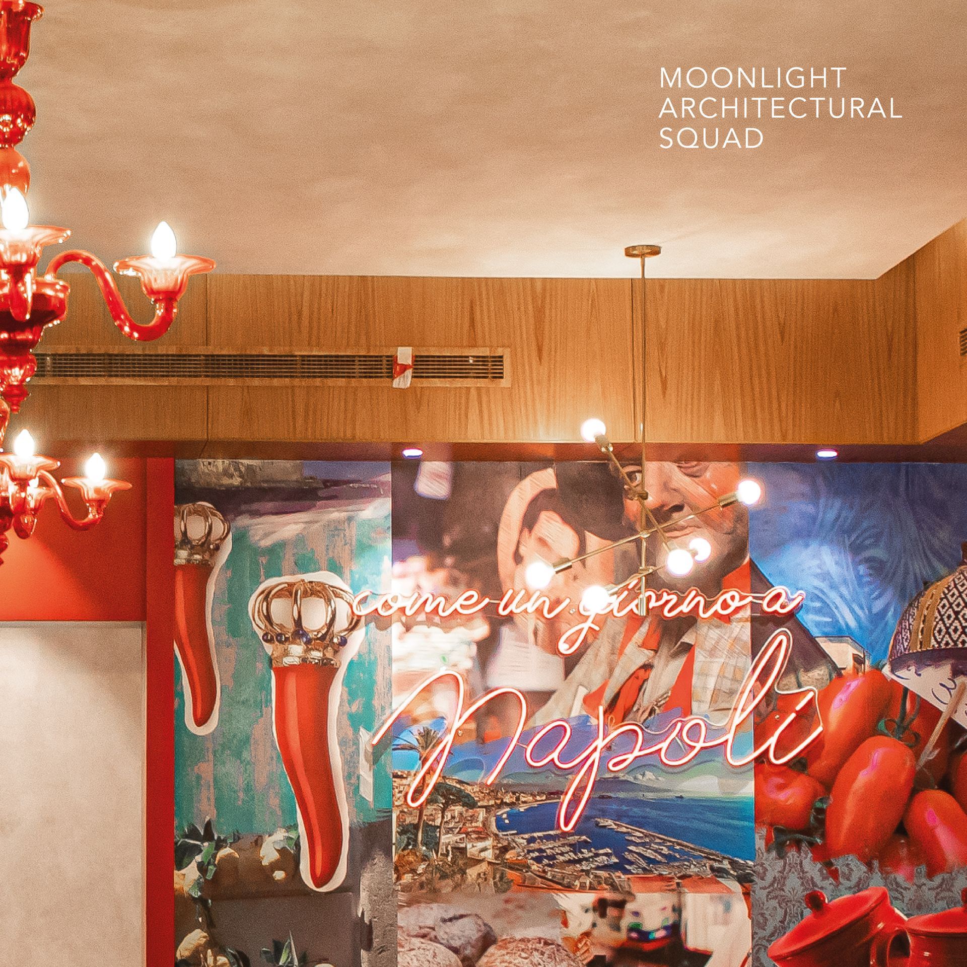Restaurant wall adorned with colorful murals and a neon sign, with warm pendant lights hanging from the ceiling.