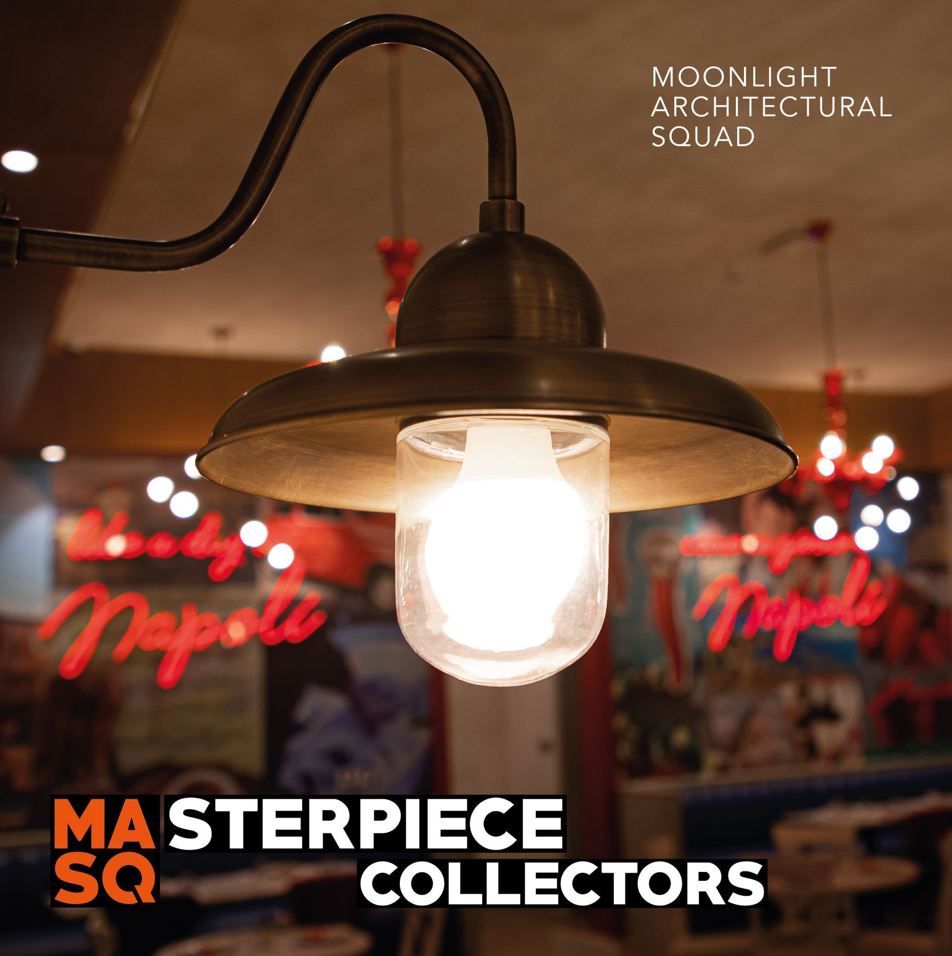 Close-up of an industrial-style pendant light with a glowing bulb at Rossopomodro in Al Maha Island, Qatar.