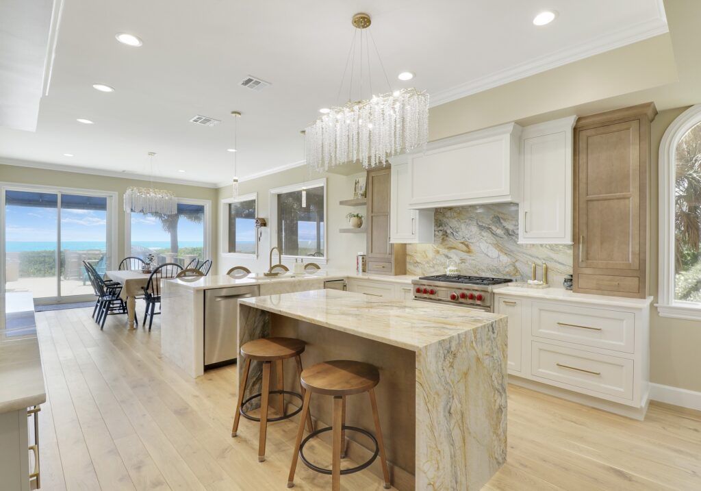 A large kitchen with a large island and stools.