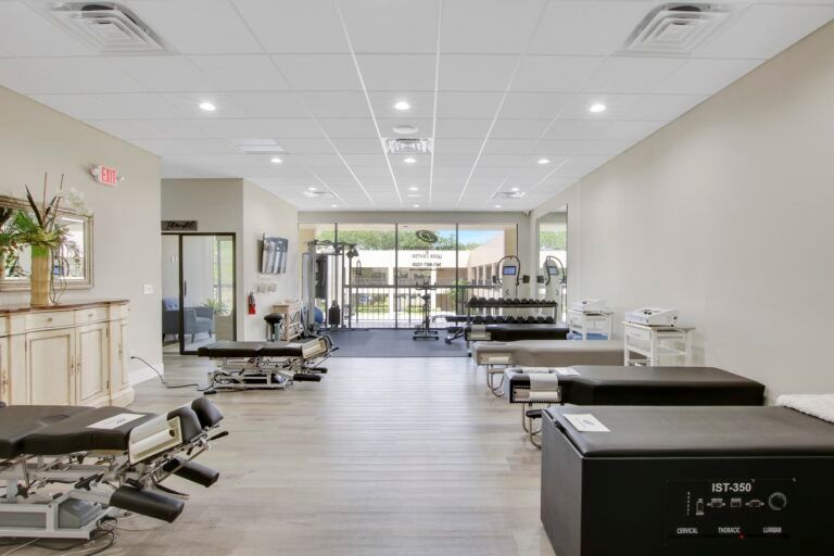 A large room with a lot of tables and chairs in it.