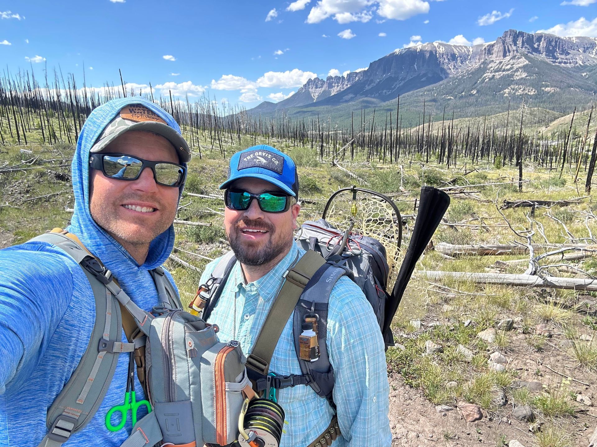 Greg and Ethan in Wyoming with mountains in the background