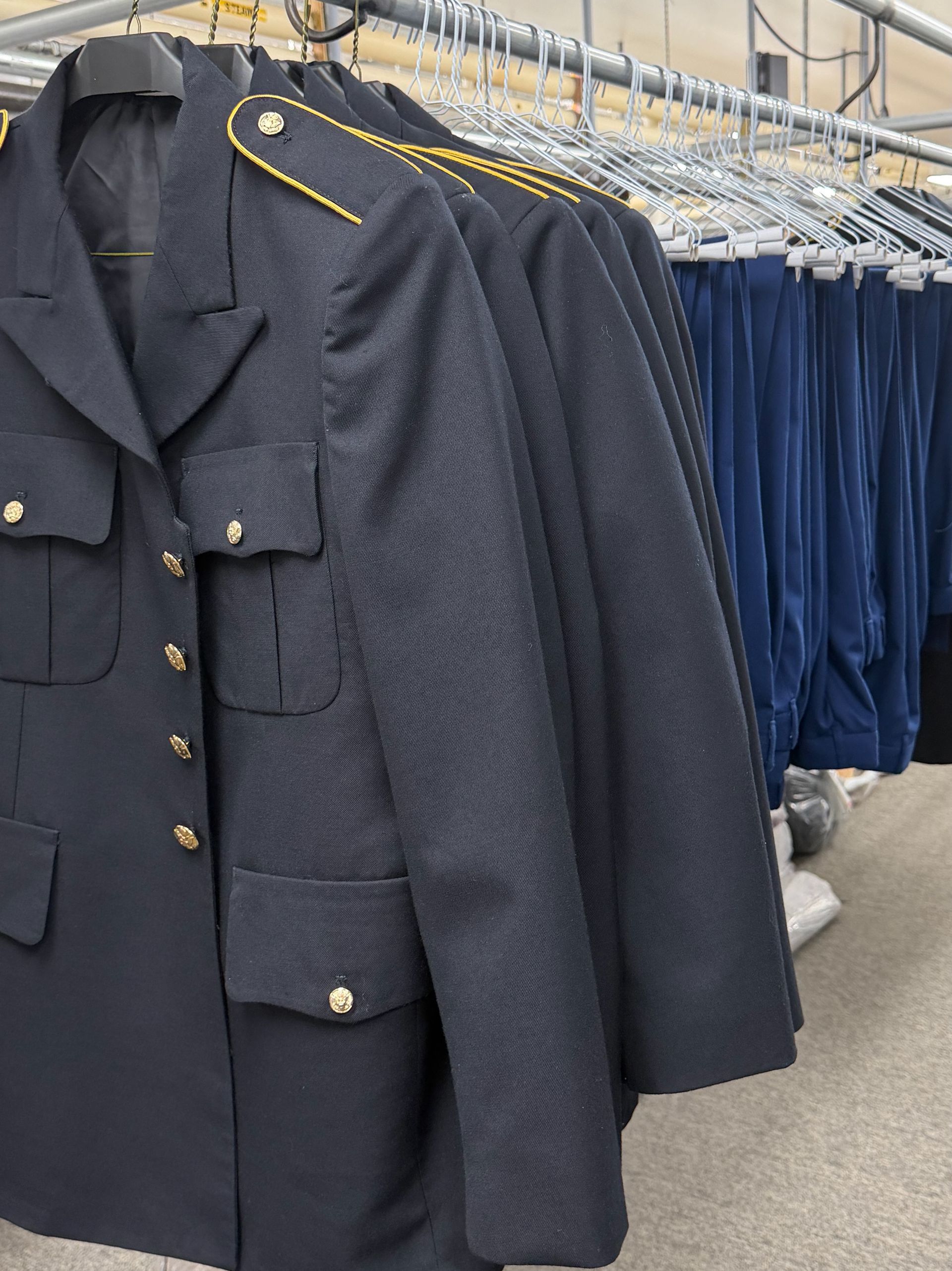 Sandpoint High School JROTC dress uniforms professionally cleaned and hanging at Country Cleaners in Hayden, Idaho.