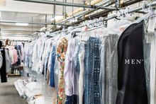 Specialty garments hanging in protective bags at Country Cleaners