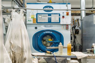 Professional dry cleaning equipment and garments at Country Cleaners