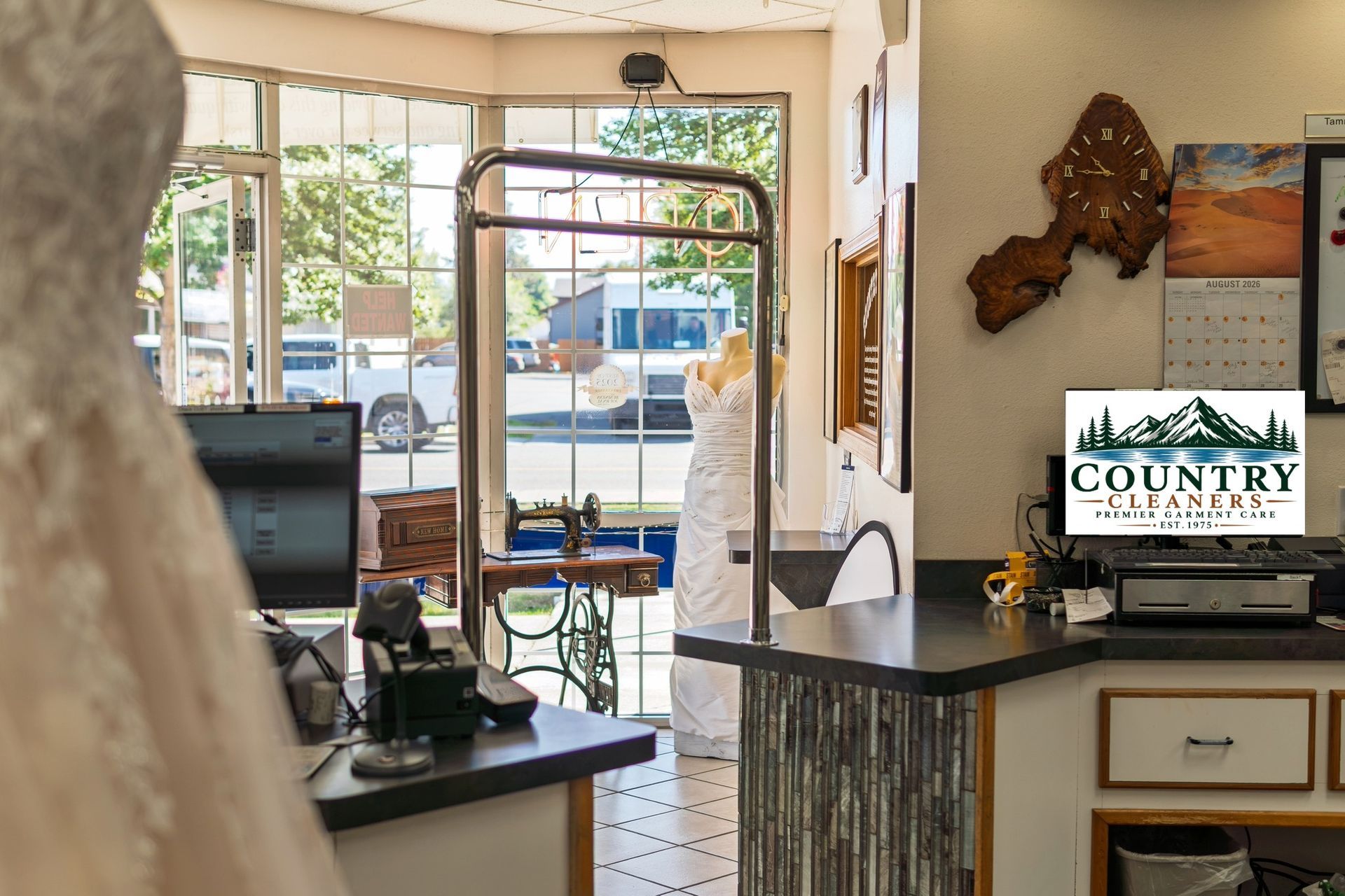 Country Cleaners front counter and store interior featuring a wedding gown display in Hayden, Idaho.