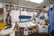 Commercial garment pressing equipment inside Country Cleaners