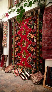 Colorful patterned specialty rugs displayed for professional rug cleaning