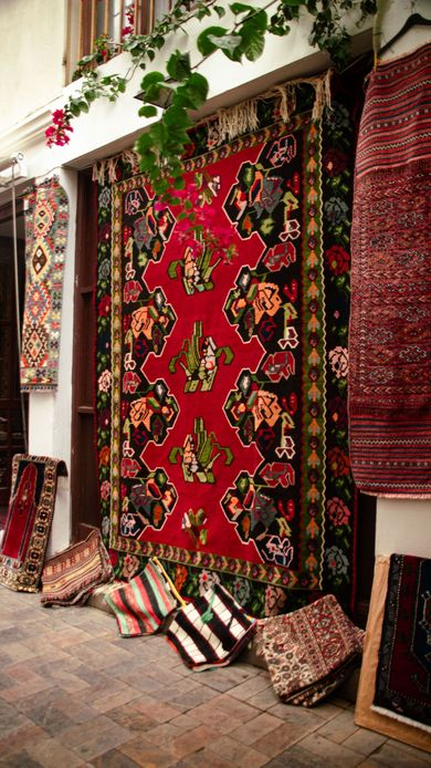Colorful area rugs representing professional rug cleaning services