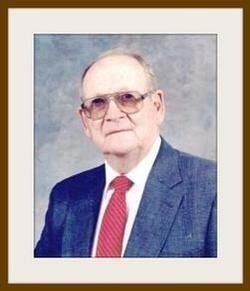 Portrait of an elderly man in glasses, blue suit, white shirt, and red striped tie on a neutral background