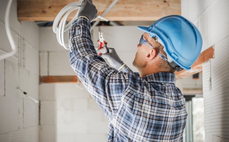 Professional Electrician During Work