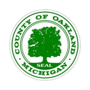 County of Oakland, Michigan seal with green tree emblem and circular text on white background