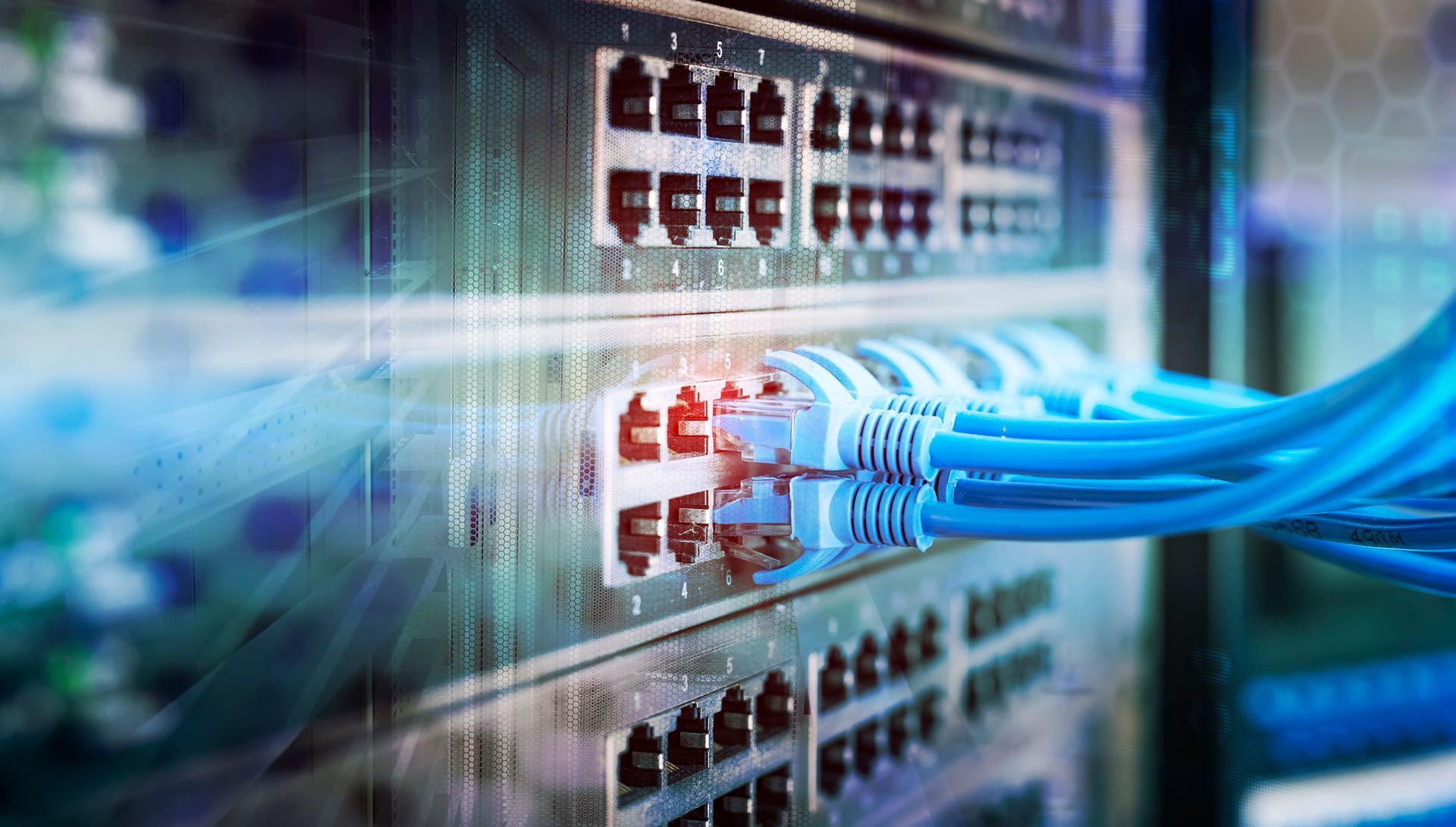 A bunch of wires are connected to a server in a data center.